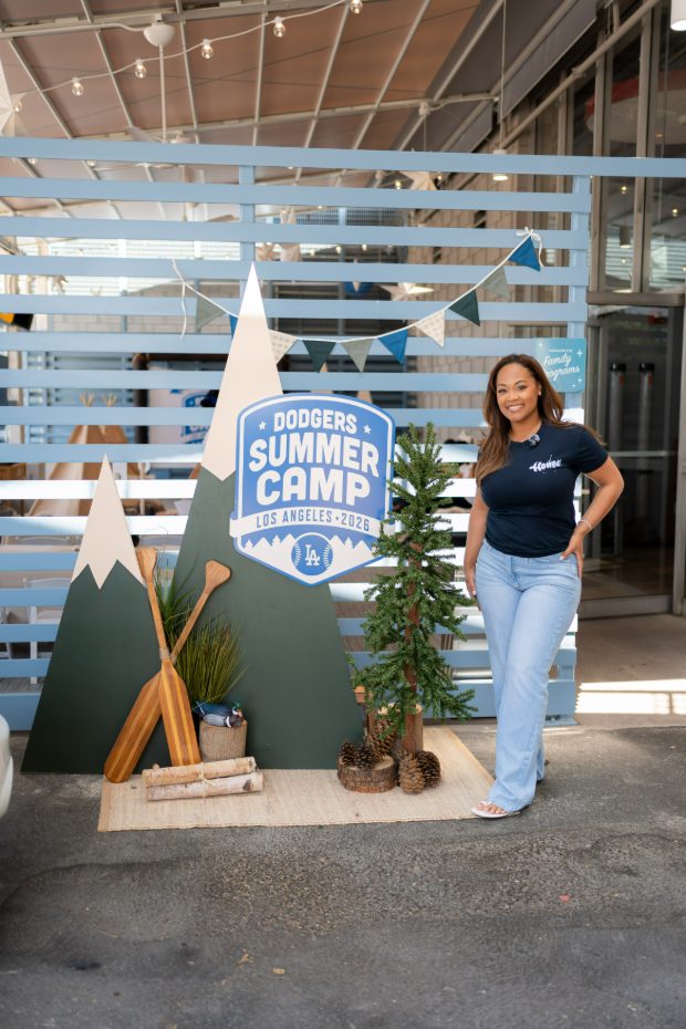 Honee founder beside the Dodgers Summer Camp sign